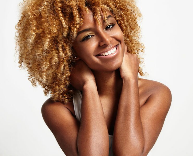 young black woman with blond curly hair