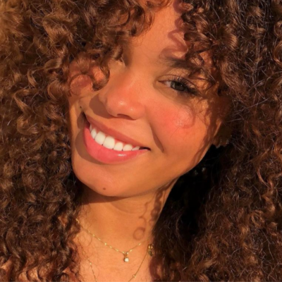 woman with curly hair and beautiful smile