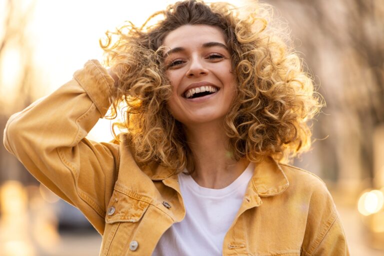 young woman with curly hair in the city