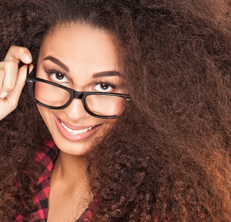 smiling beautiful african american girl with long curly hair.