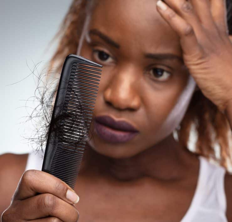 woman combing her hair